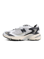 New Balance men's 725 Matter Black sneakers, side view with black and gray athletic design
