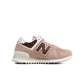 Women's New Balance 574 sneakers in Rich Oak color, showcasing casual footwear with white and brown accents.