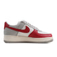 Red toe Nike Air Force 1 '07 LV8 men's sneakers with white midsole and red accents, showcasing classic Nike footwear style.