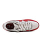 Red toe Nike Air Force 1 '07 LV8 men's footwear featuring white leather and stylish design, perfect for casual wear.