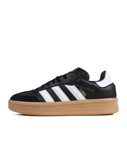 Black Adidas Mens Samba XLG footwear with white accents, showcasing the classic design and textured sole.
