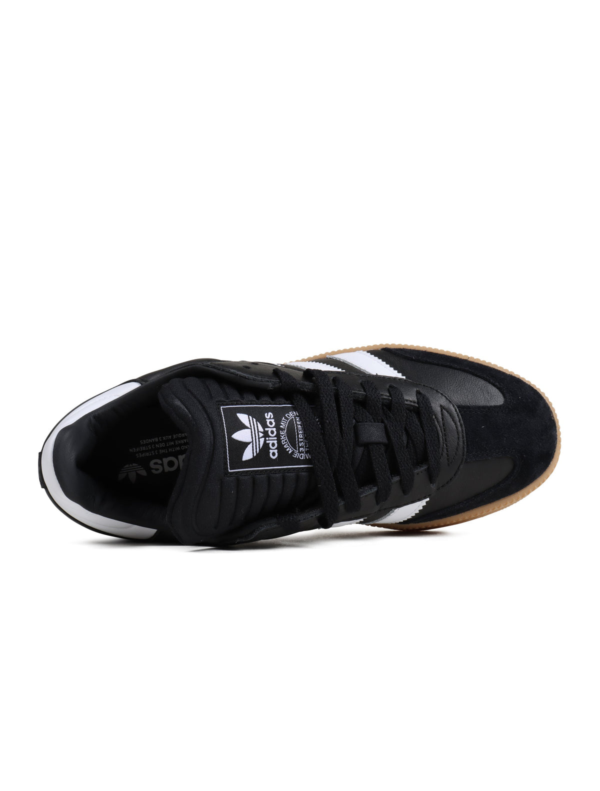 Black Adidas Mens Samba XLG footwear shown on a model, featuring classic design and durable leather construction.
