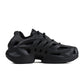 Black Adidas Mens Adifoam footwear with cushioned sole and sleek design, displayed on a white background.