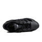 Black Adidas mens Adifoam footwear featuring sleek design and comfortable cushioning, ideal for casual or athletic wear.