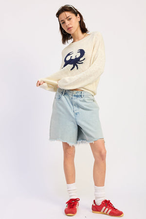 Light denim Riley denim shorts by Emory Park, casual fit with distressed detailing and rolled cuffs.