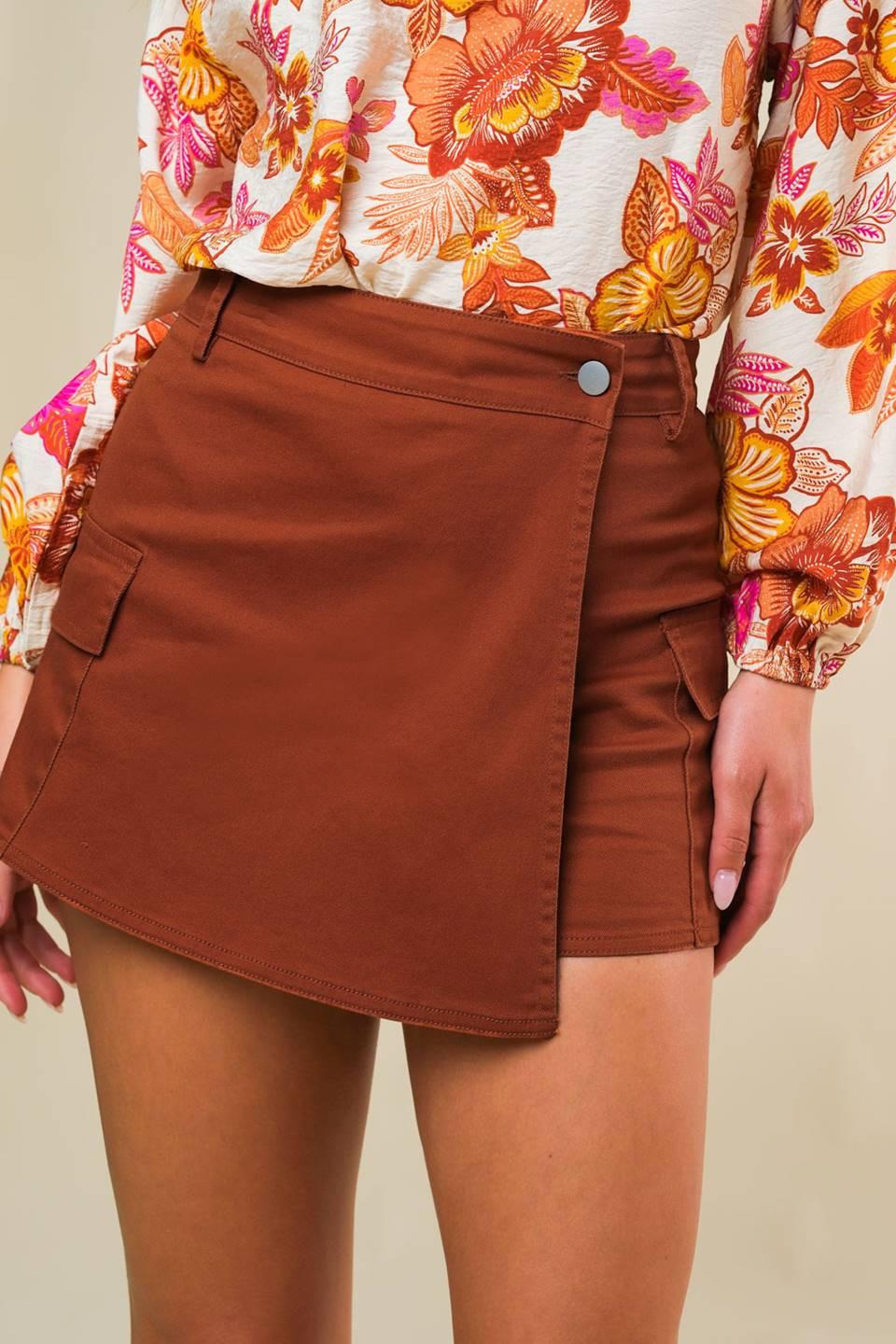 Rust-colored Flying Tomato twill skort, casual shorts with a structured design, featuring a front button and side pockets.
