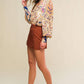 Bronze Flying Tomato Flirt for Fun woven skort shorts with a stylish, casual design, perfect for summer outings and active wear.
