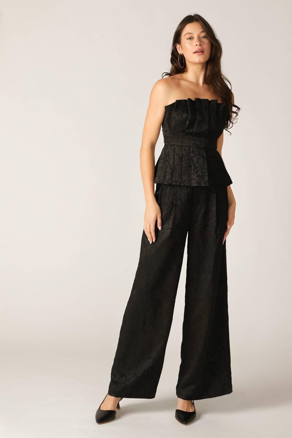 Black Elegant Essence Woven Pants by Flying Tomato, showcasing a stylish and comfortable woven pant design.