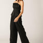 Black Elegant Essence woven pants by Flying Tomato, featuring a stylish, tailored design with intricate woven fabric details.