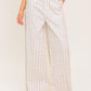 Ivory woven pants from Flying Tomato Citrus Flow collection, featuring a relaxed fit and textured fabric.