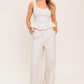 Flying Tomato Citrus Flow Ivory woven pants, lightweight and stylish with a relaxed fit, shown in a natural pose.