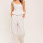 Flying Tomato Citrus Flow ivory woven pants showing lightweight, relaxed fit with textured fabric in a natural ivory color.