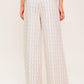 Flying Tomato Citrus Flow ivory woven pants, lightweight and stylish women's pants with a relaxed fit and textured fabric.