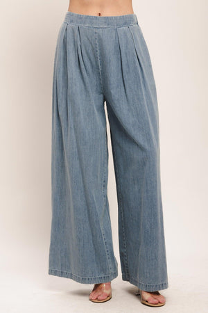 Lightweight relaxed drape denim pants by Flying Tomato in light indigo, featuring a casual fit and modern style.