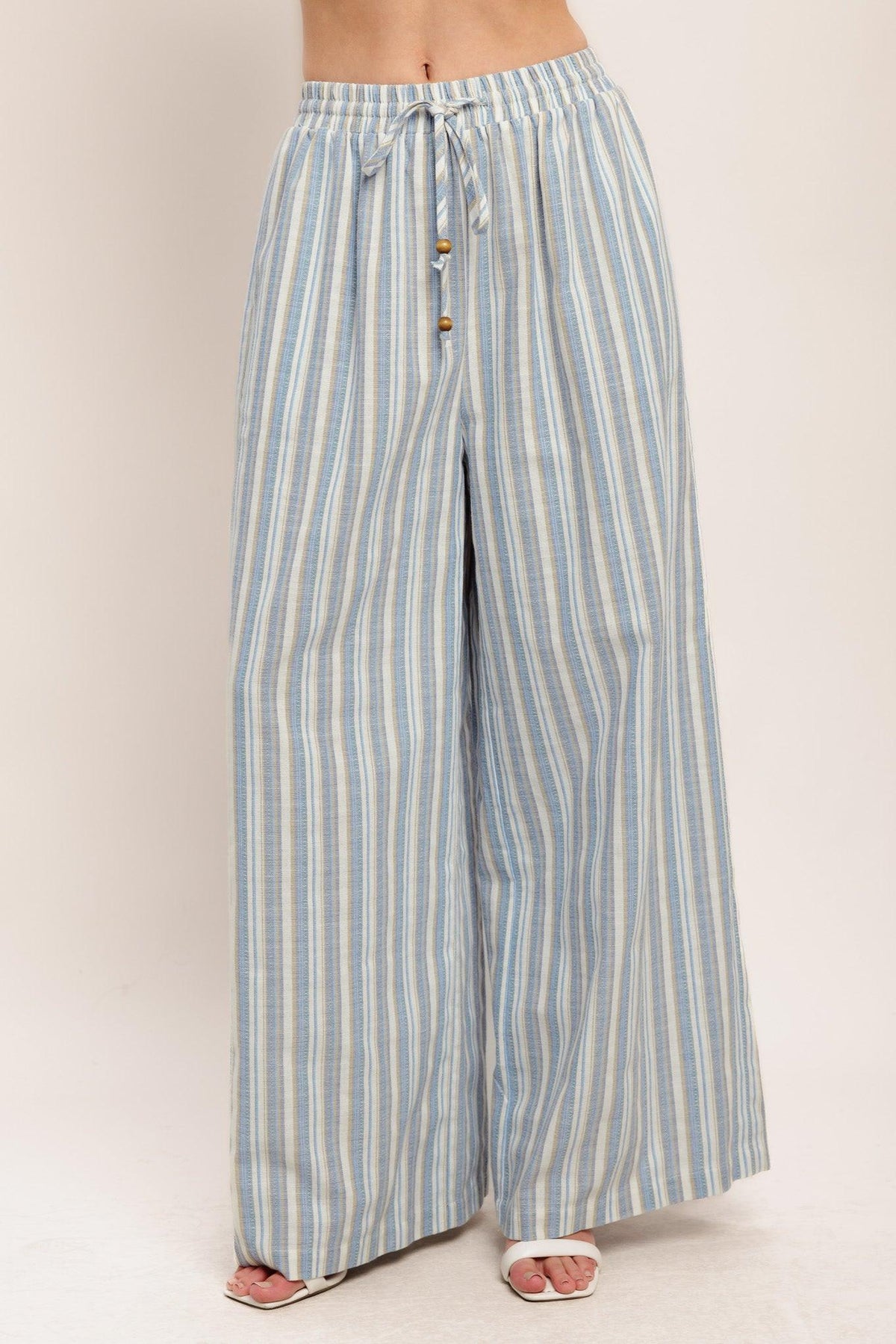Flying Tomato Coastal Day Strip Woven Pants in ivory and blue, featuring a relaxed fit and woven fabric design.