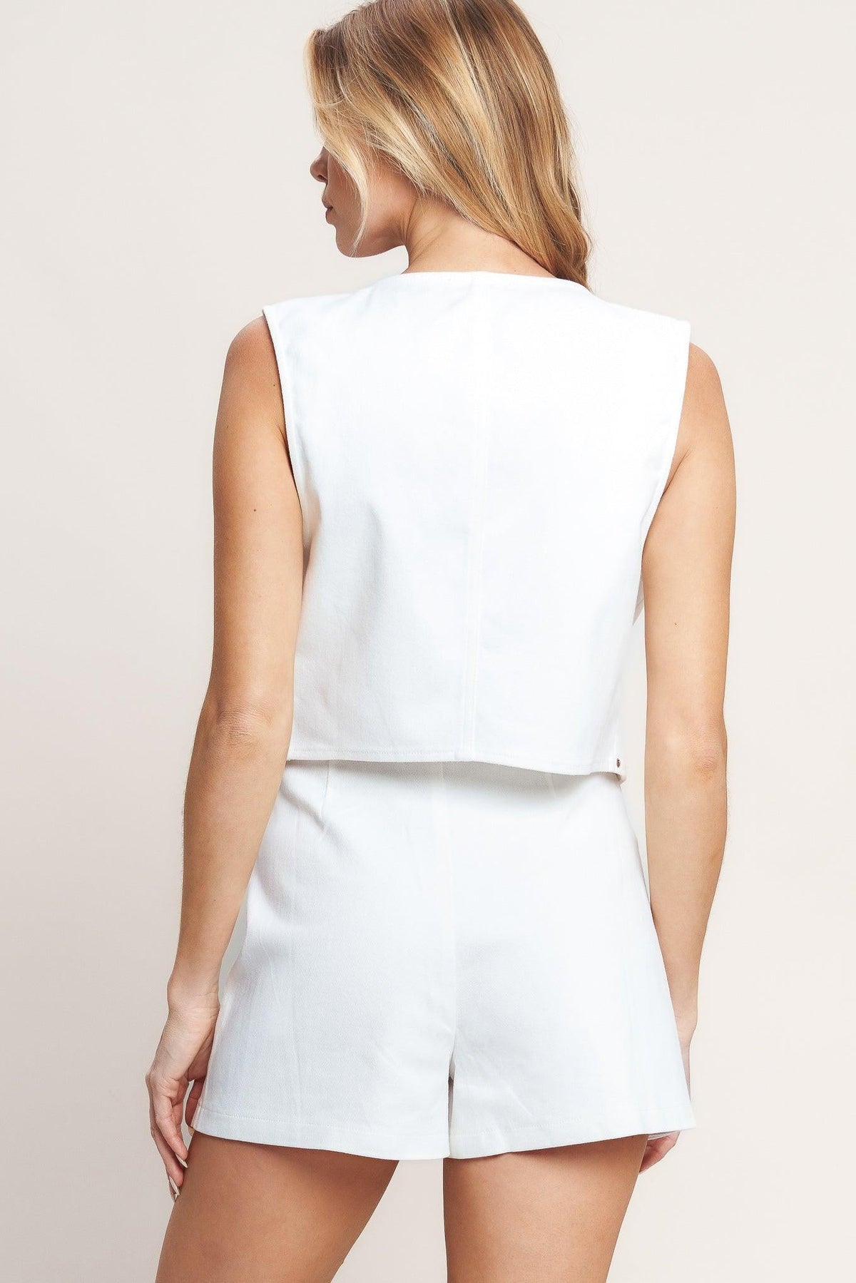 White woven shorts from Flying Tomato's All Eyes on You Woven Skort collection, featuring a stylish, casual design.