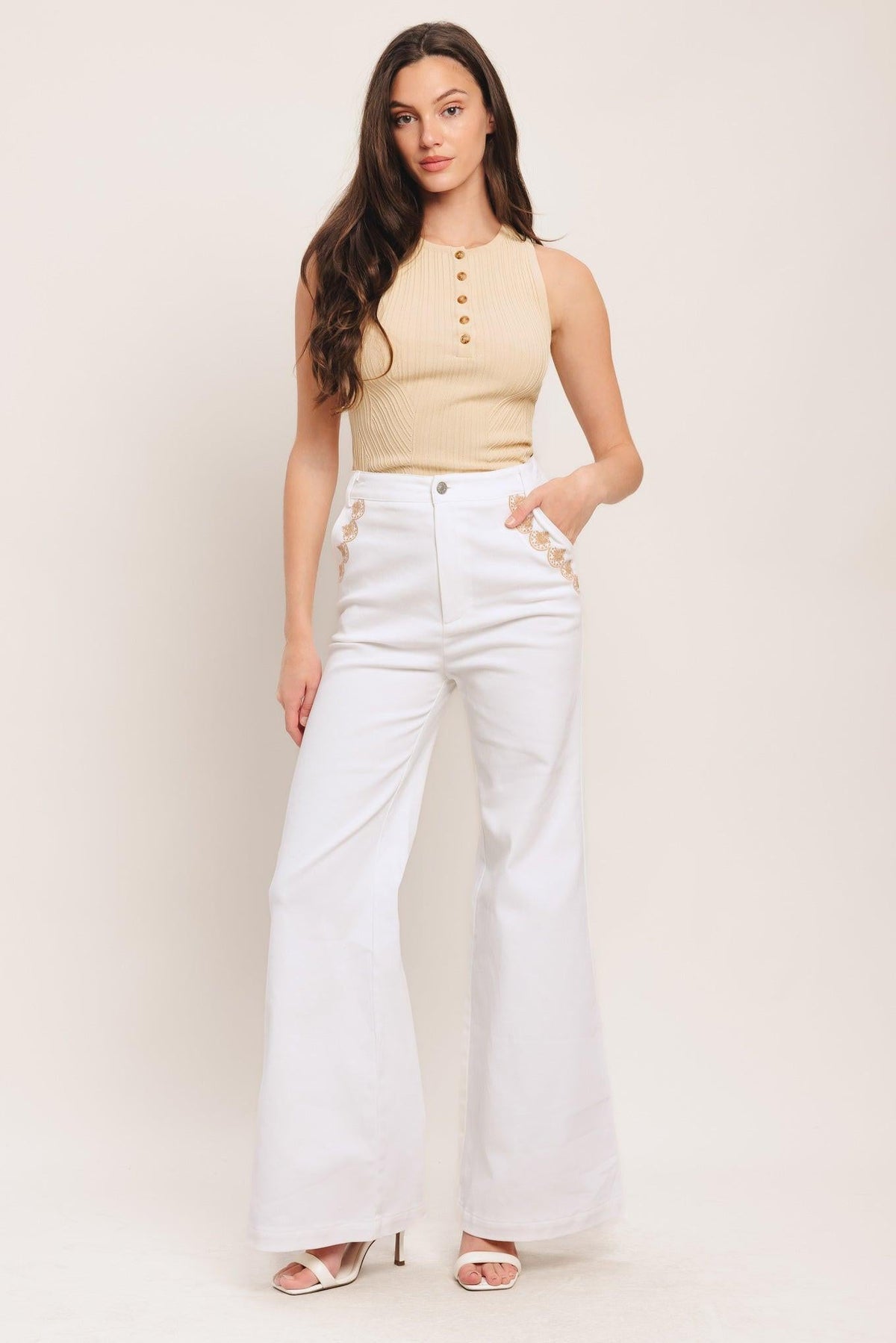 Flying Tomato open road white woven pants, denim-style pants with a relaxed fit and detailed stitching, displayed on a hanger.