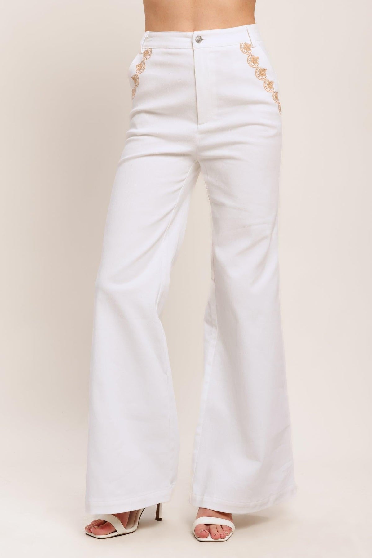 Flying Tomato Open Road white woven pants, casual denim-style pants with a relaxed fit and woven texture, shown on a model.