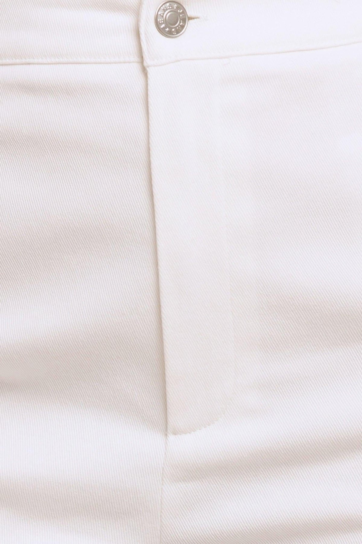 Flying Tomato Open Road white woven pants, casual denim style with a relaxed fit and woven fabric, shown on a model.