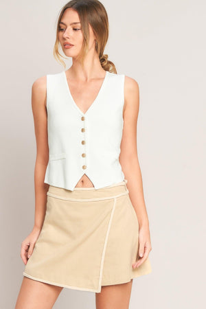 Beige Elevated Essential Woven Skort by Flying Tomato, showing the front view with a high-waist design and woven fabric texture.