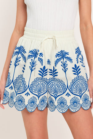 Flying Tomato Coastline Palm Woven Shorts in ivory and blue, featuring a relaxed fit with palm print design.