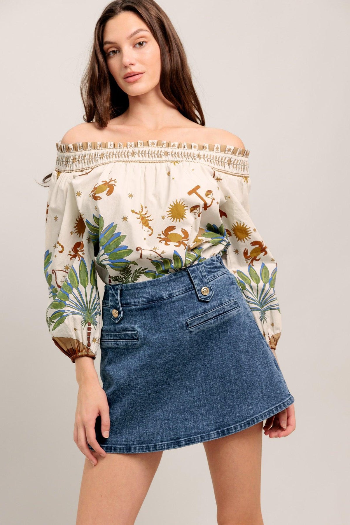 Flying Tomato Heart Eyes Denim Skort shorts in medium indigo with heart eye graphic and front pockets.