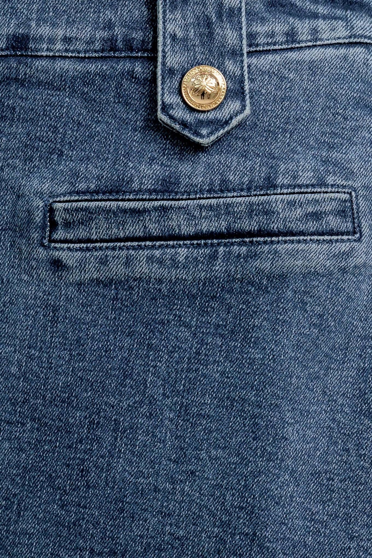 Flying Tomato Heart Eyes Denim Skort, medium indigo shorts with heart eye graphic print and frayed hem detail.