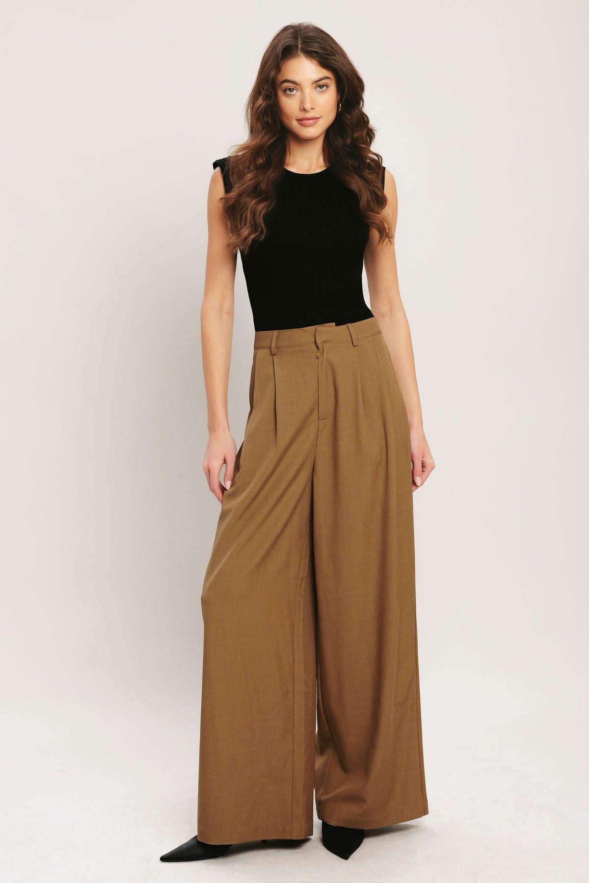Flying Tomato Umber Flow woven wide-leg pants in brick color, showing the relaxed fit and textured fabric.