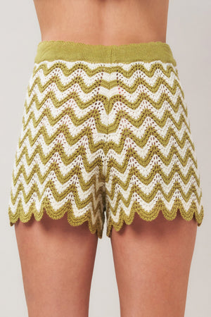 Olive white crochet knit shorts by Flying Tomato with sunset stitch pattern, casual summer style, front view.