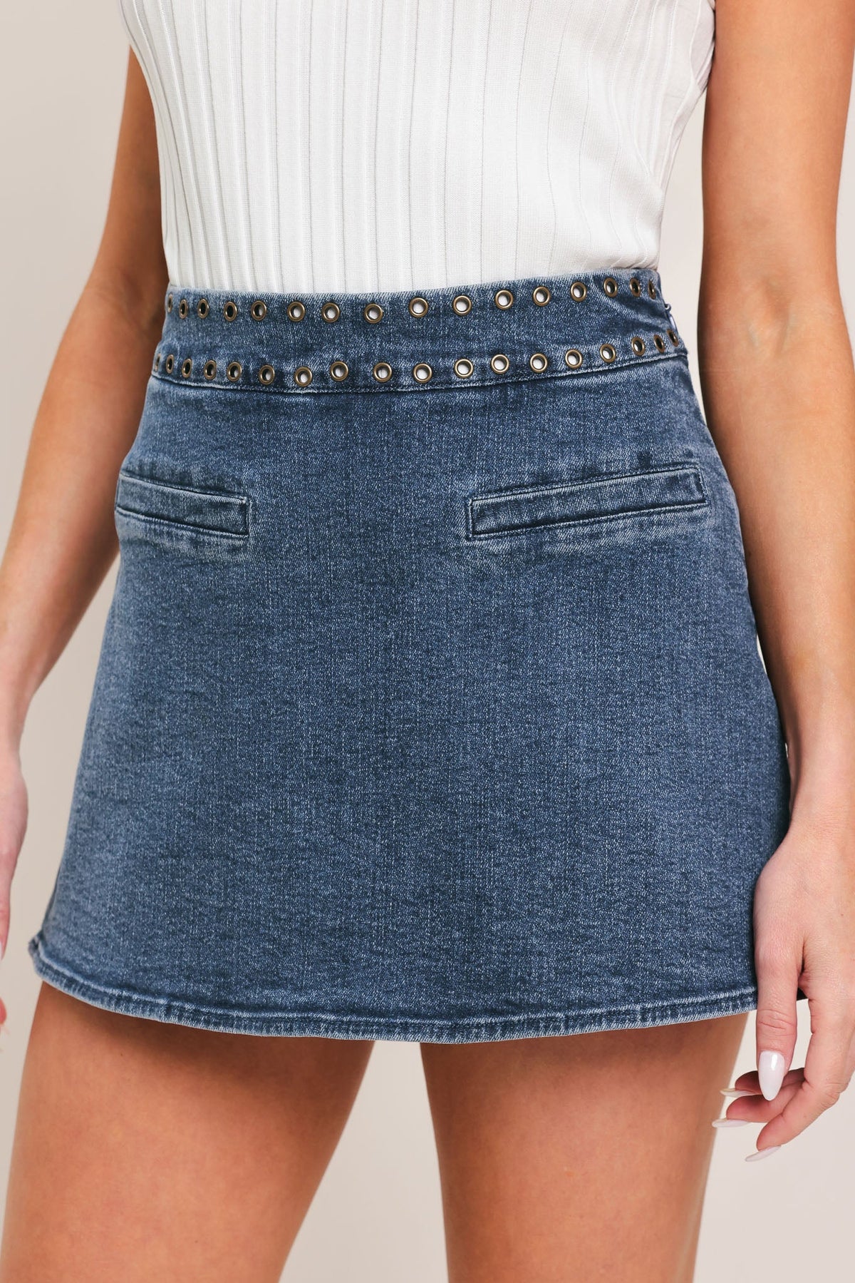 Flying Tomato Sweet Stud Denim Skort in medium indigo with stud embellishments, casual stylish design for warm-weather outfits.