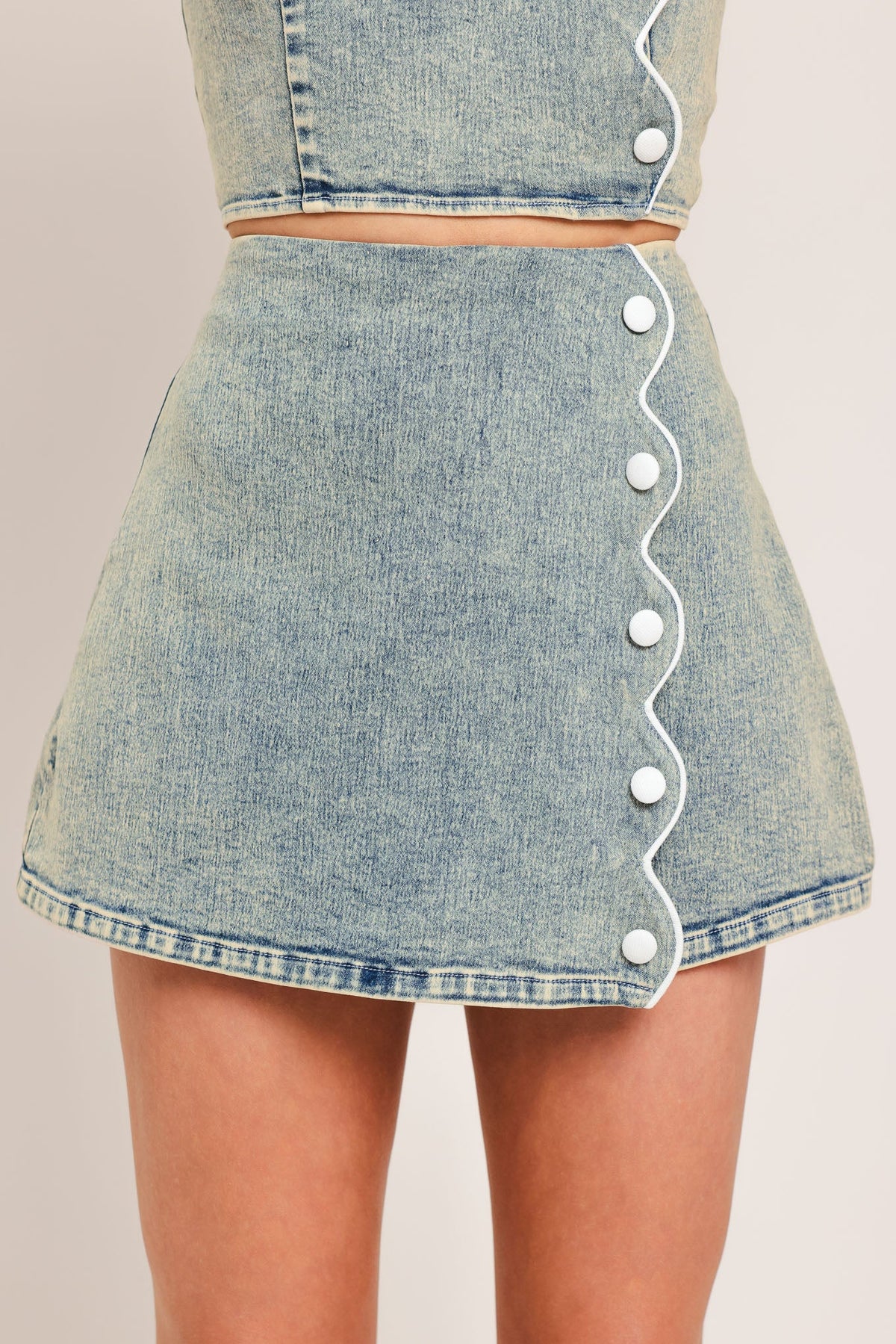 Flying Tomato Sweet Detail Denim Skort showing front view with layered denim design and asymmetrical hem detail.