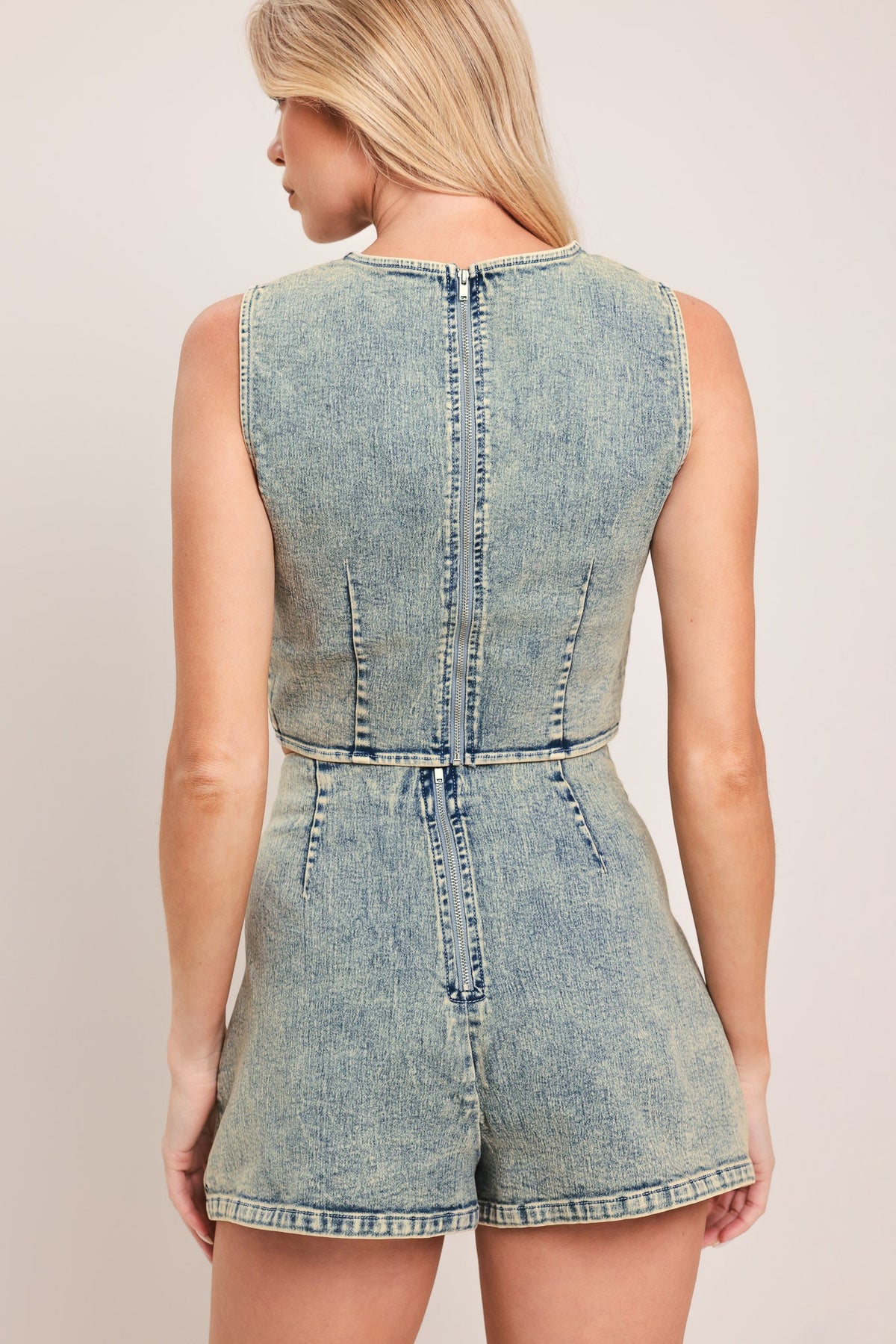 Flying Tomato Sweet Detail denim skort showing front view with distressed denim fabric and floral embroidery, casual summer style.