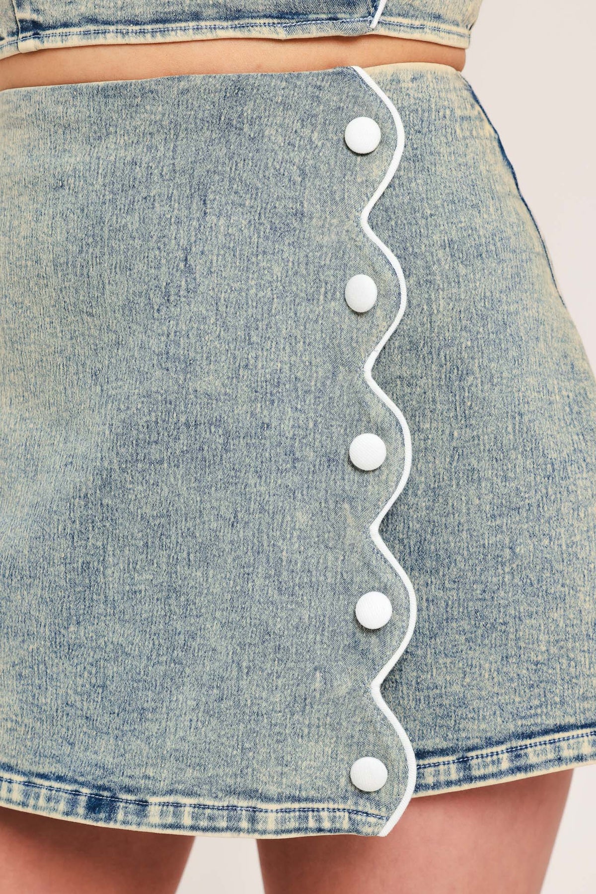 Flying Tomato Sweet Detail Denim Skort, front view showing light wash denim fabric and subtle stitched detailing on the skort.