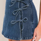 Flying Tomato STREET TIE denim skort in medium indigo with a tied waistband and stylish design, suitable for casual wear.