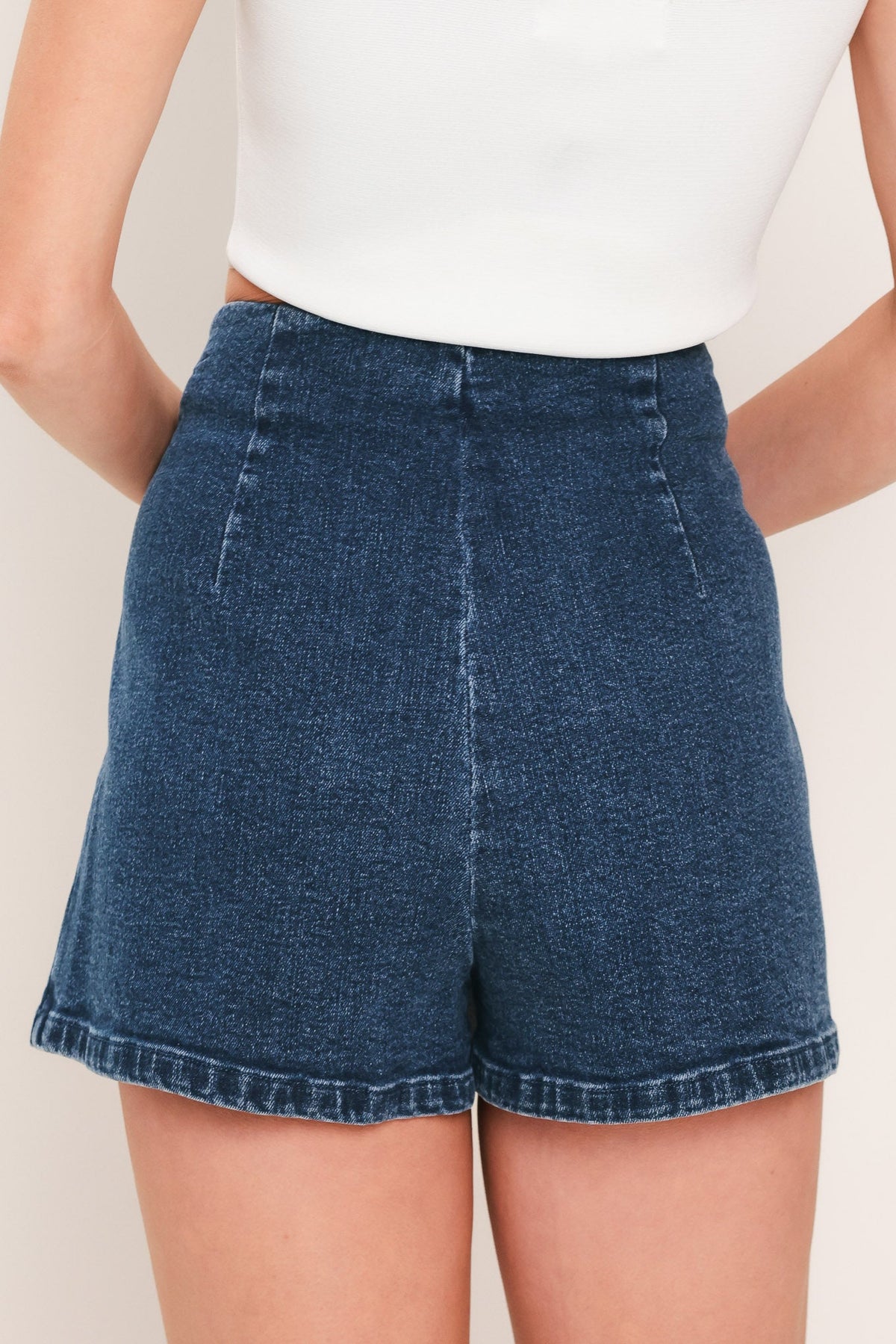 Flying Tomato street tie denim skort in medium indigo with front tie detail and classic denim styling.