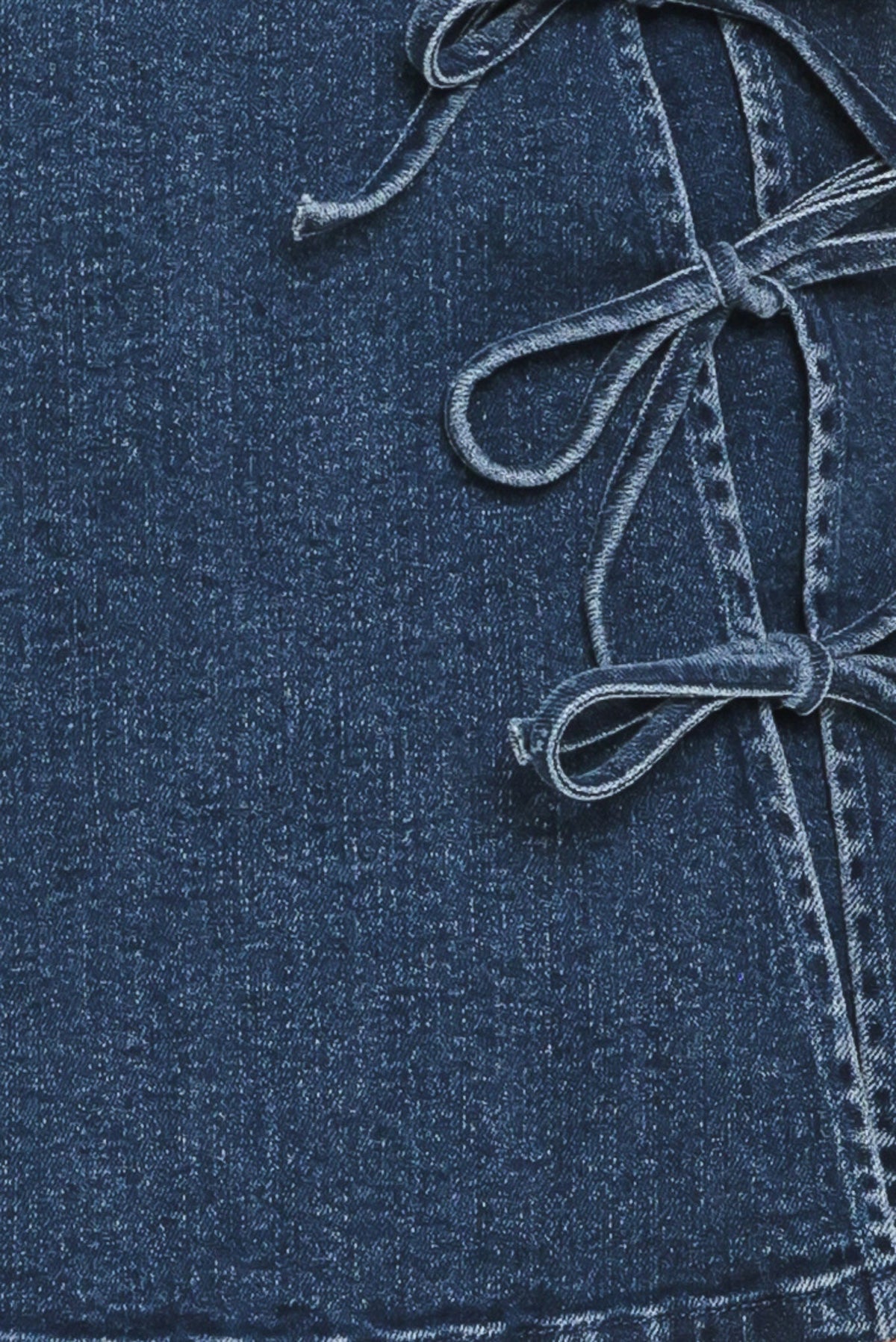 Flying Tomato street tie denim skort in medium indigo with front tie detail, casual and stylish for everyday wear.