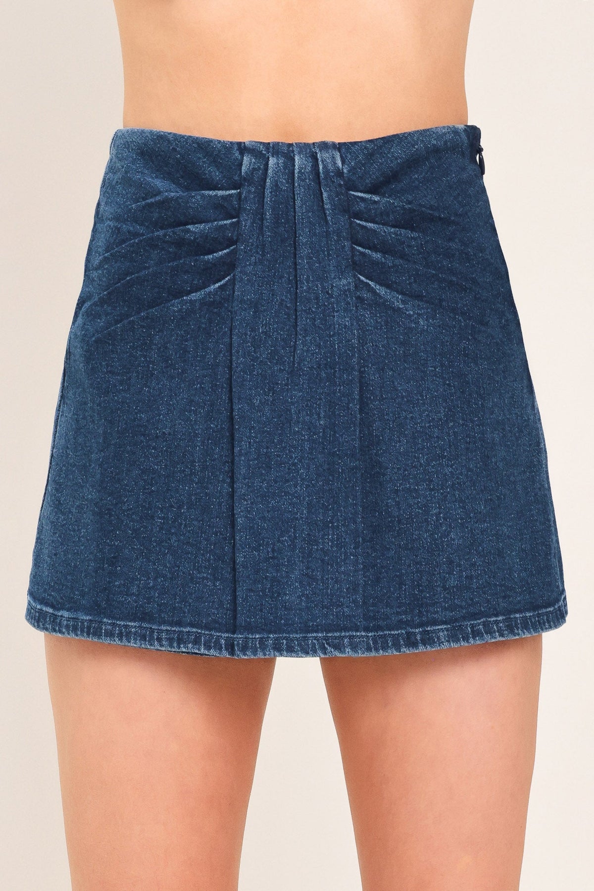 Flying Tomato indigo ruching denim skort with front pockets and adjustable waistband, styled on a model.