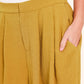 Mustard-colored woven pants by Flying Tomato, showcasing a stylish and comfortable design with a relaxed fit.