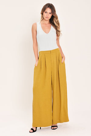 Flying Tomato Golden State of Mind woven pants in mustard color, showing relaxed fit and textured fabric.