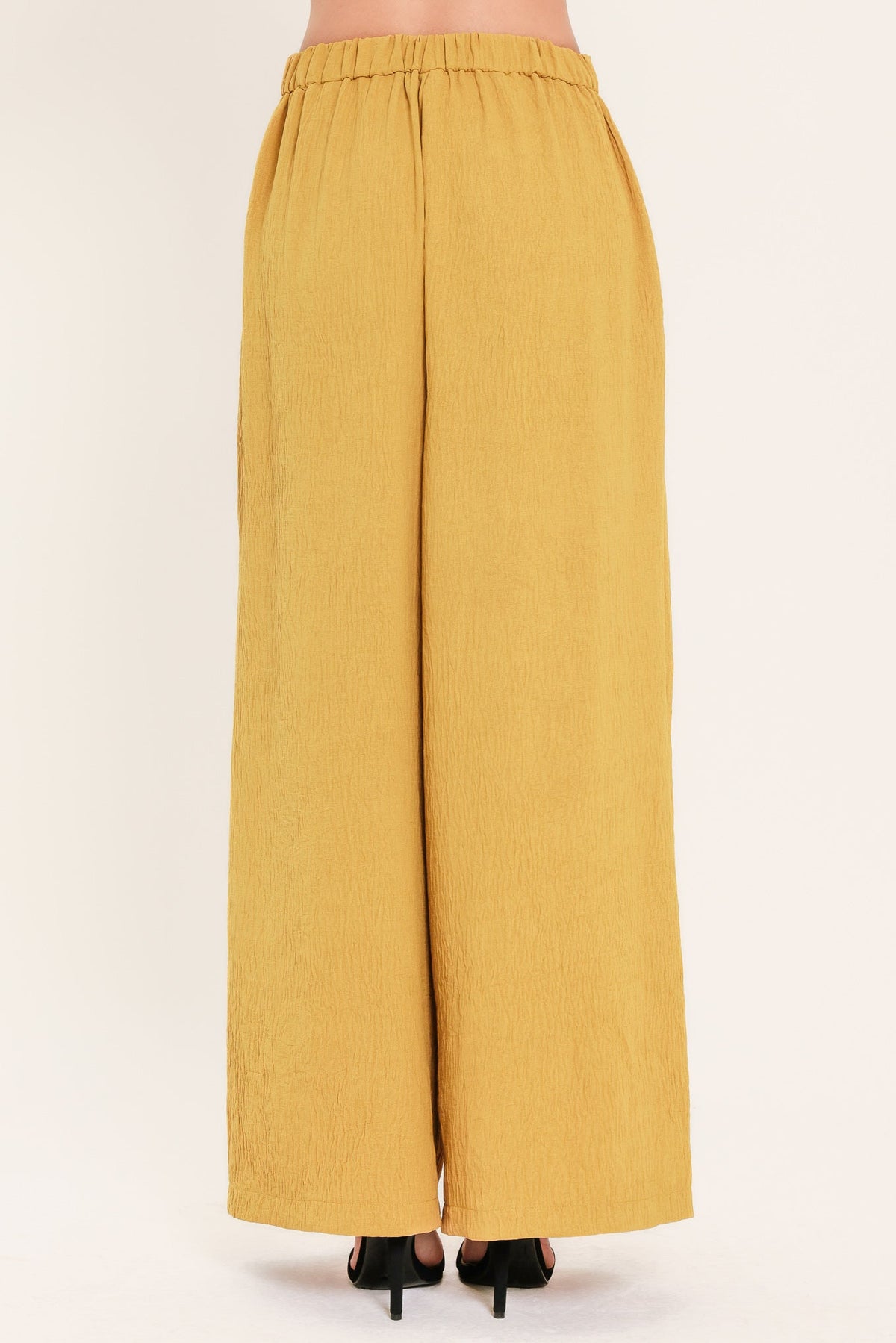 Flying Tomato Golden State of Mind woven pants in mustard color with a relaxed fit and intricate woven pattern.
