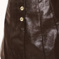 Dark brown faux leather skort from Flying Tomato with a lacquered finish, featuring a high-waisted design and side pockets.