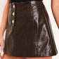 Dark brown faux leather skort by Flying Tomato featuring a sleek lacquered finish and stylish design.