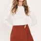 Rust-colored Spiced Horizon Tencel side-zip skort by Flying Tomato, featuring a stylish design and side zipper detail.