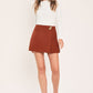 Flying Tomato spiced horizon rust Tencel side-zip skort, showing rust-colored fabric with side zipper detail and relaxed fit.