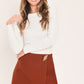 Flying Tomato spiced horizon rust Tencel side-zip skort, showcasing the rust-colored fabric with a side zipper and relaxed fit.