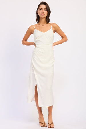 White Coralie Midi Dress by Emory Park, showcasing its elegant design and flowing fabric in a close-up image.