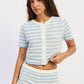 Emory Park Gemma Top in ivory and blue stripe, featuring a stylish sleeveless design with a fitted silhouette.