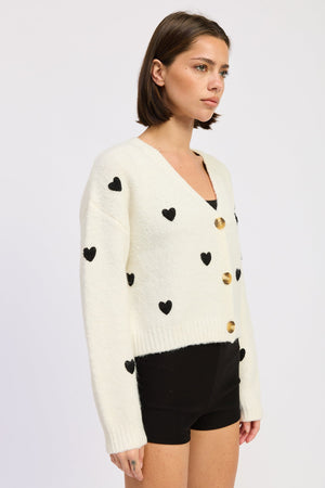 Emory Park Juliette cardigan in ivory and black featuring a cozy knit design and button-up front.