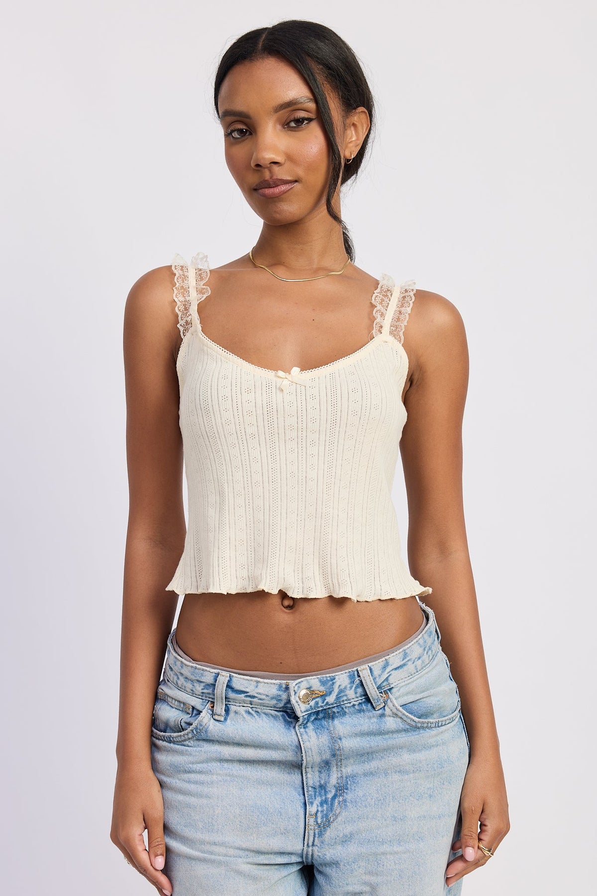 Emory Park Fable Ivory top with long sleeves and V-neck, styled with subtle pleats and a relaxed fit.