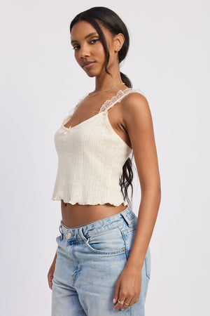 Emory Park Fable Ivory top with ruffled neckline and short sleeves, stylish addition to casual or office outfits.